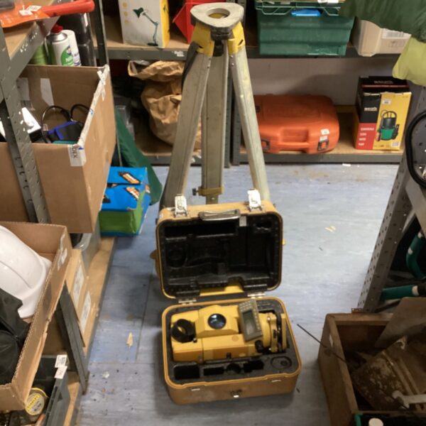 Vintage surveyors measuring stick with tripod and case.