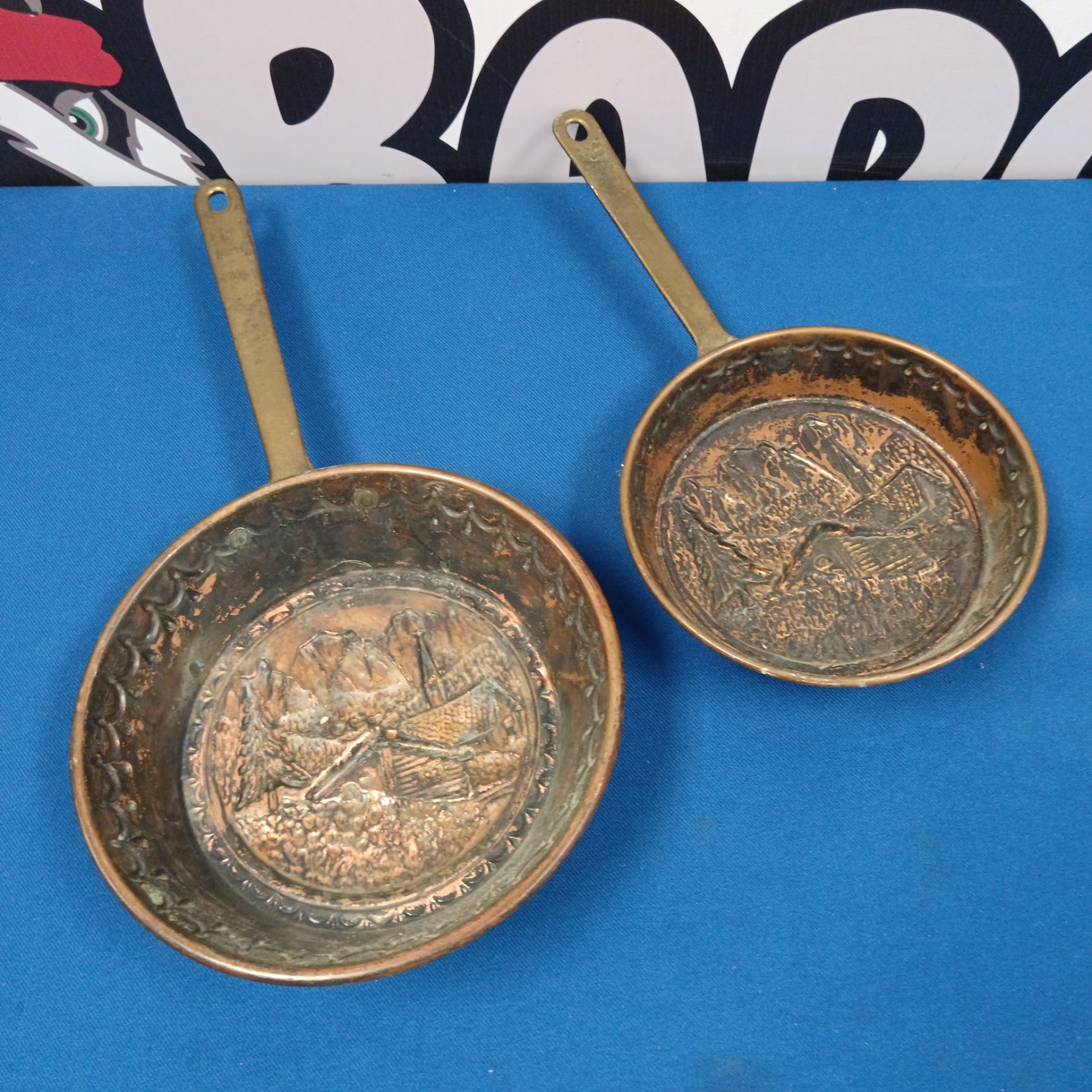 Vintage Swiss church pattern copper wall pan with embossed design.