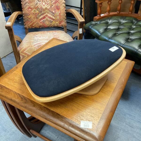 Vintage tailored pressing board with black fabric surface.