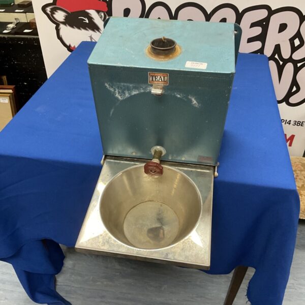 Vintage teal mobile wash station with stainless steel sink.