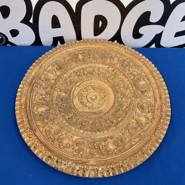 Vintage terracotta tray with detailed relief carvings, a unique decorative piece.