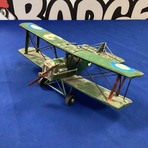 Vintage tin biplane with red, white, and blue markings.