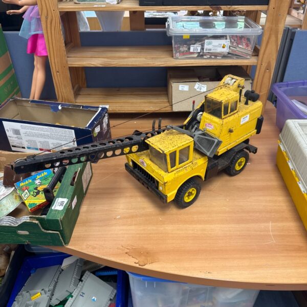 Vintage Tonka metal crane toy, showing signs of age.