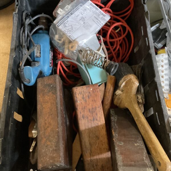 Vintage tool lot with planes, drill and sharpening block.