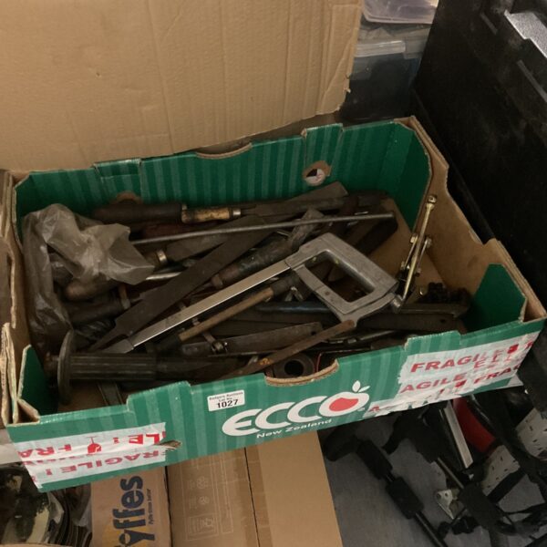 Vintage tool lot featuring saws and chisels in a box.