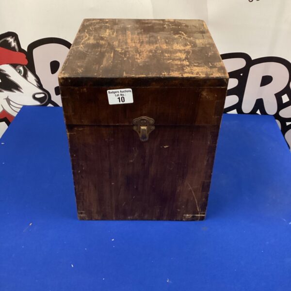 Vintage wooden top hat box with a metal clasp.