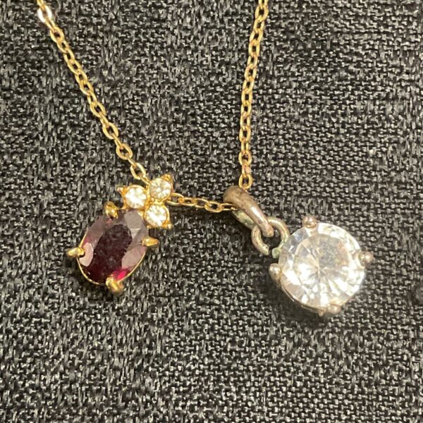 Vintage two pendant necklace with red and clear stones.