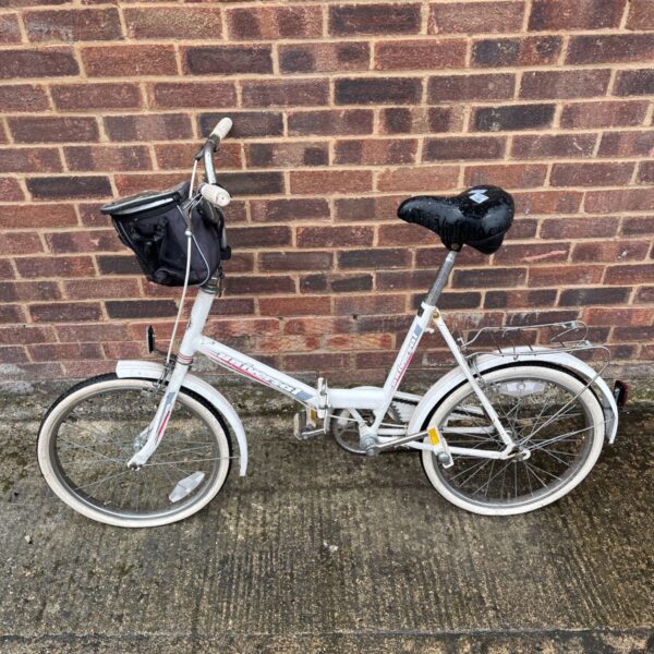 Vintage Universal UniSport folding bicycle with front basket and 20 inch wheels.