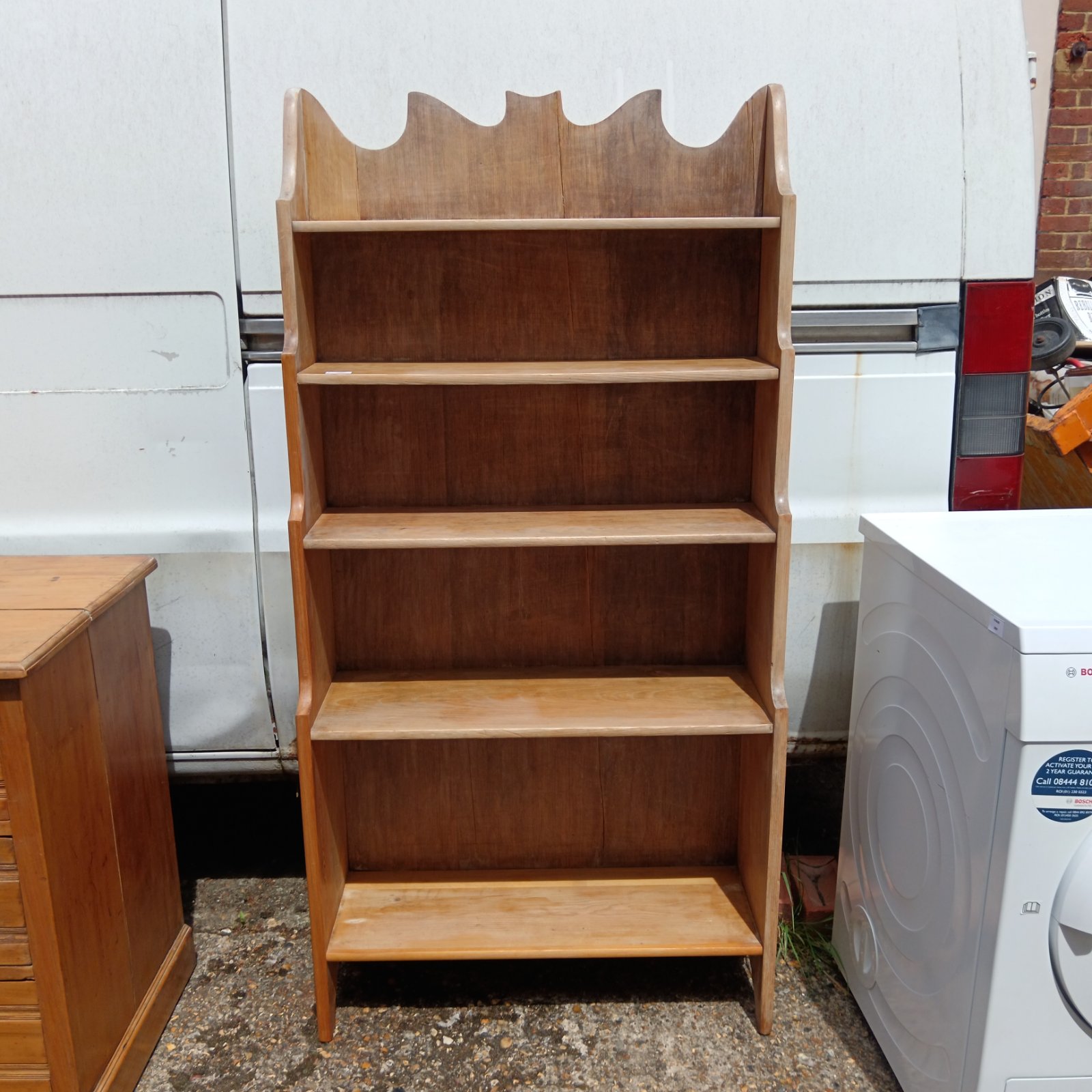 Vintage wooden waterfall bookcase with five tiers.