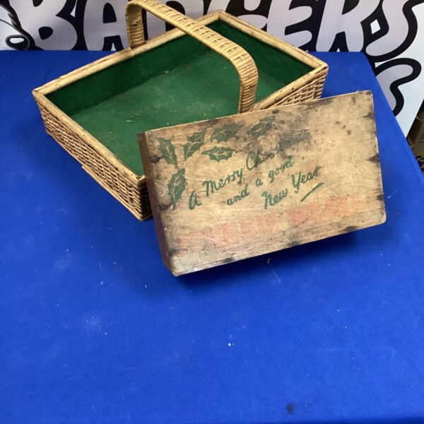 Vintage wicker basket and tray with a seasonal greeting.