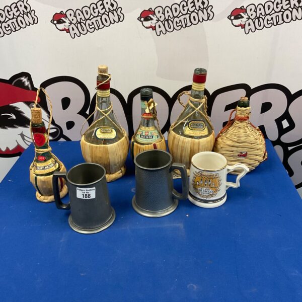 Vintage wine bottles and a pewter tankard, collectible antique barware.