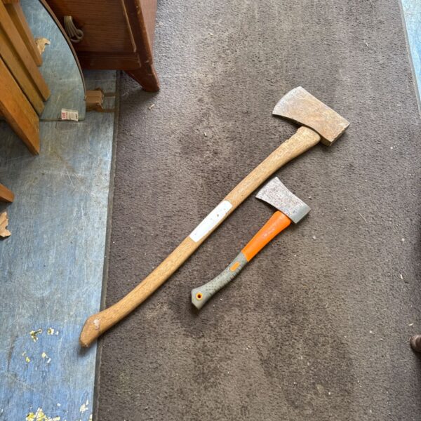 Vintage wood axe set with large axe and hand axe.