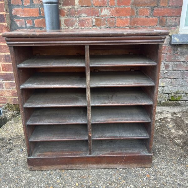 Vintage industrial wooden pigeon hole unit for office storage.
