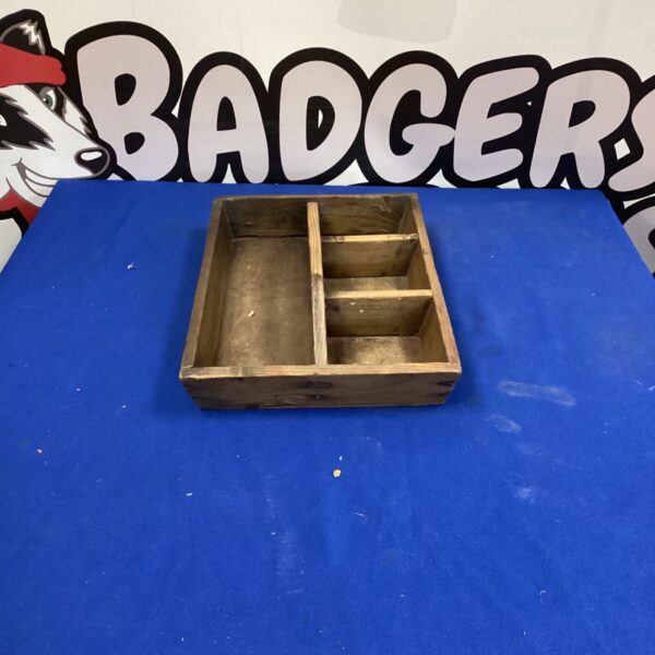 Vintage wooden tool tray for workshop storage and rustic decor.
