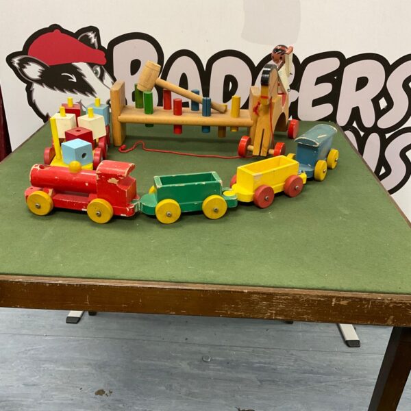 Colourful vintage wooden train set with locomotive and carriages.