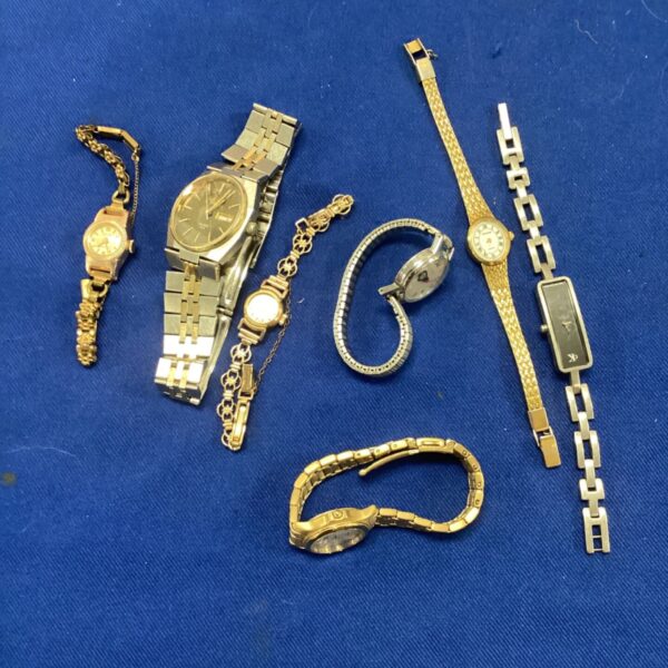 Vintage wristwatches bundle featuring gold tone and silver designs.