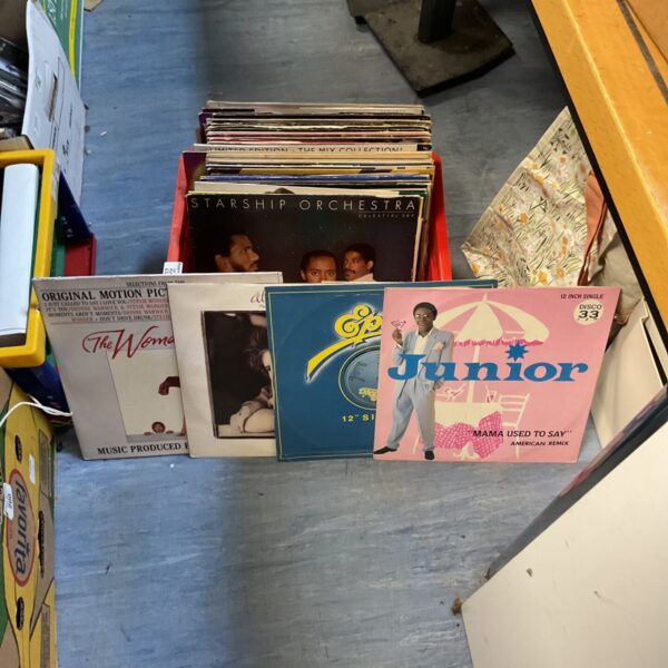 Mixed lot of 12 inch vinyl records including Beach Boys album.