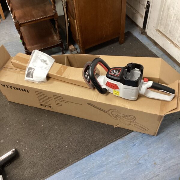 Unused Vitinni electric chainsaw in original packaging, garden tool.