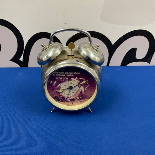 Vintage Volvo alarm clock with chrome finish and analog face.