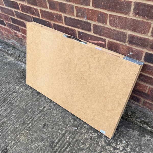 Large wallpaper pasting table with handles, ideal for DIY projects.
