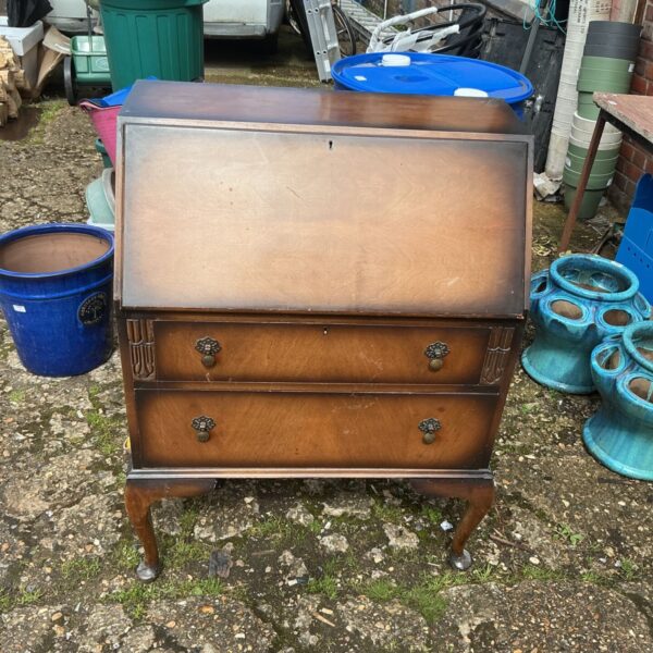 Antique walnut writing bureau with drop leaf and cabriole legs.