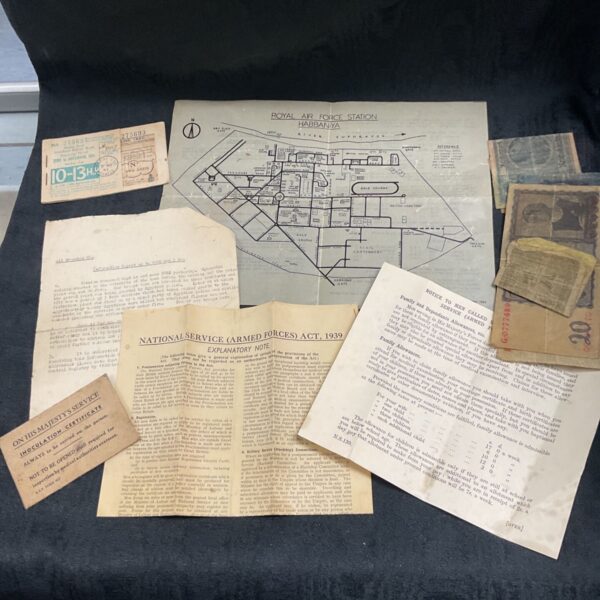 Wartime military ephemera collection including RAF documents and German banknotes.