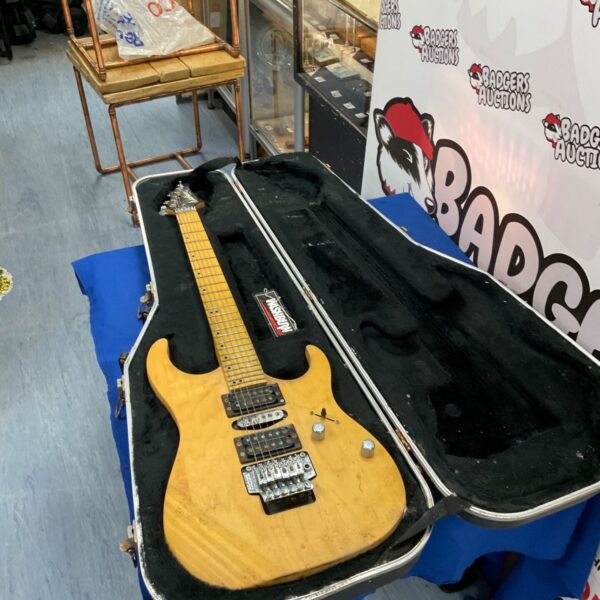 Washburn electric guitar in a hard case, vintage musical instrument.