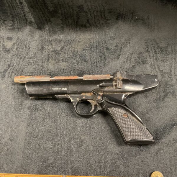 Vintage Webley Hurricane air pistol with ruler for scale.