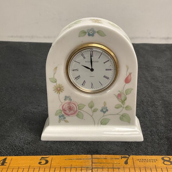 Wedgwood Rosehip clock with floral design and quartz movement.