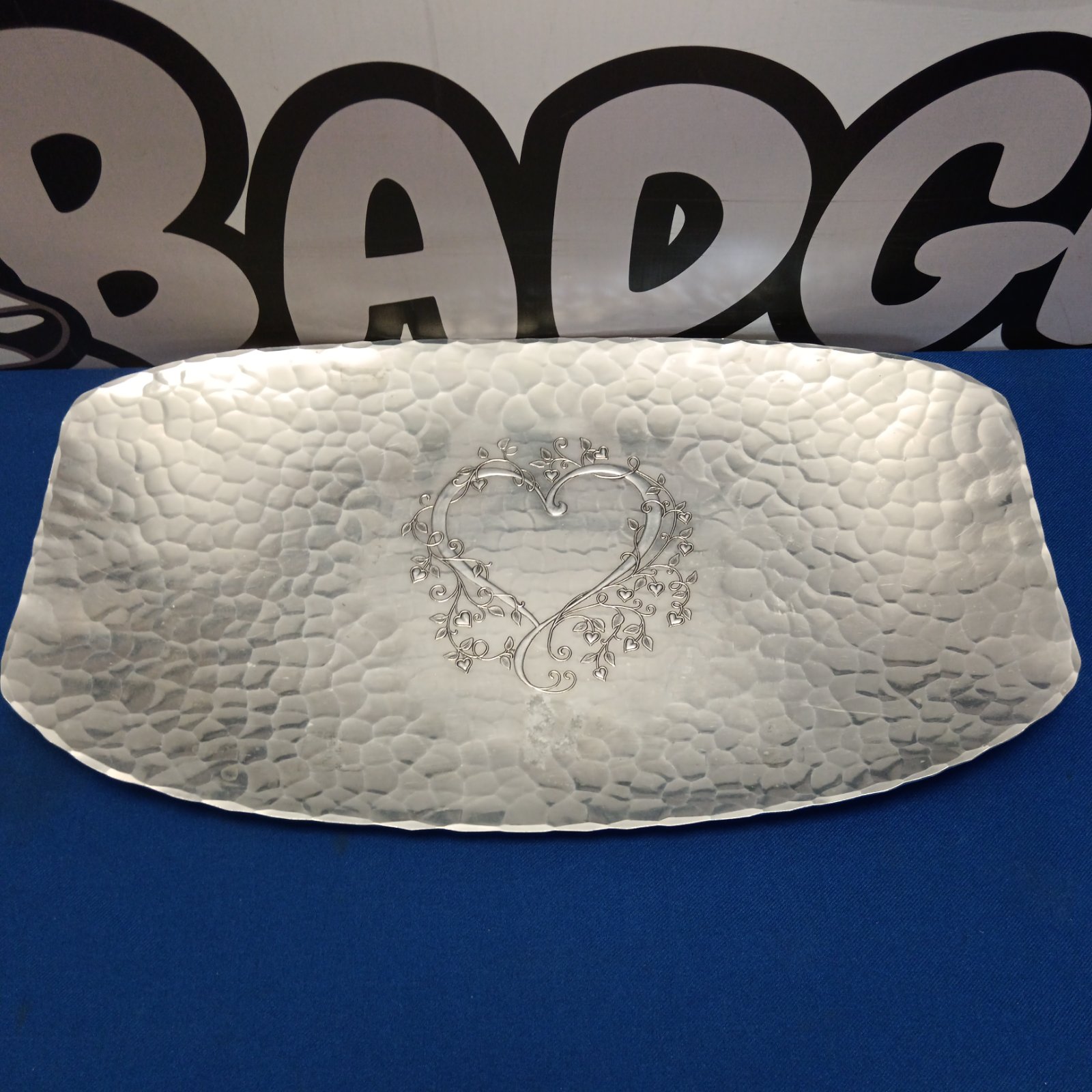 Wendell August silver tray with heart design, hammered texture.