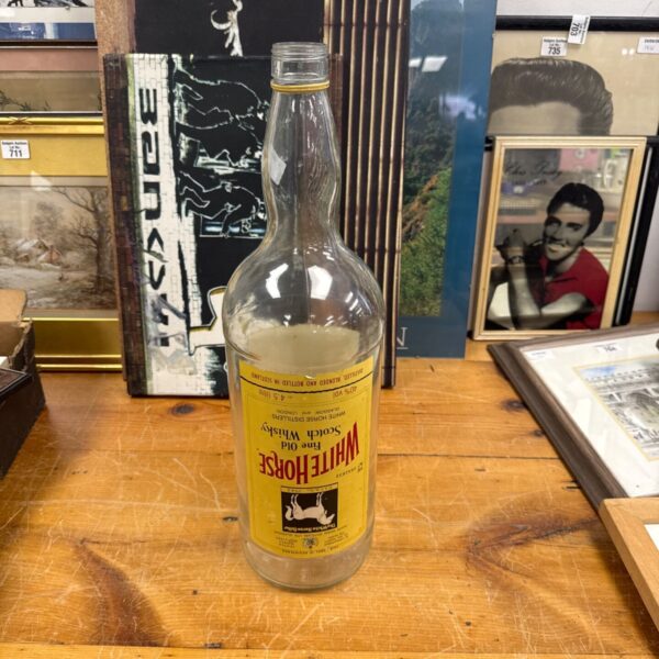 Vintage 4.5l White Horse Scotch Whisky coin saver bottle.