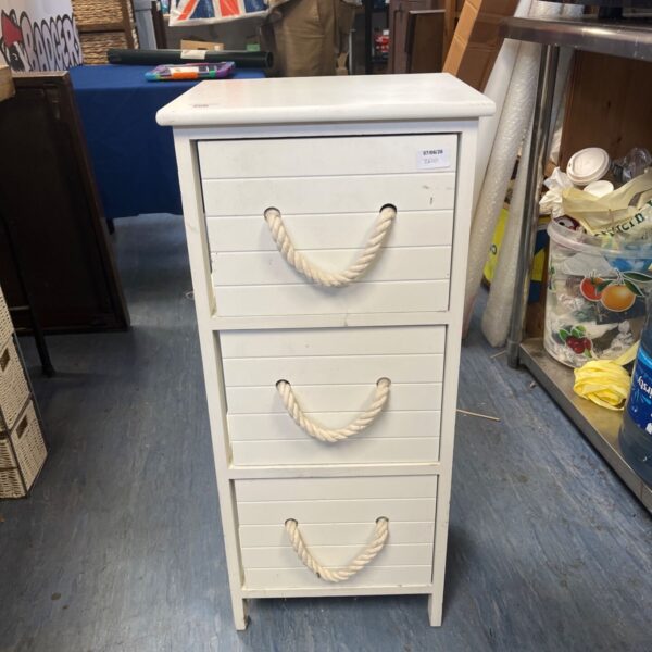 White wooden cabinet with rope handles for farmhouse storage.
