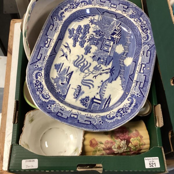 Antique Willow Pattern bowl with detailed transferware design.