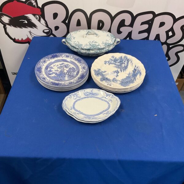 Antique Willow Pattern plates and serving dish in blue and white.