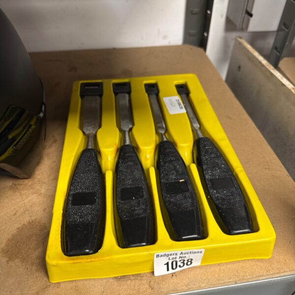 Unbranded wood chisel set in a plastic tray.