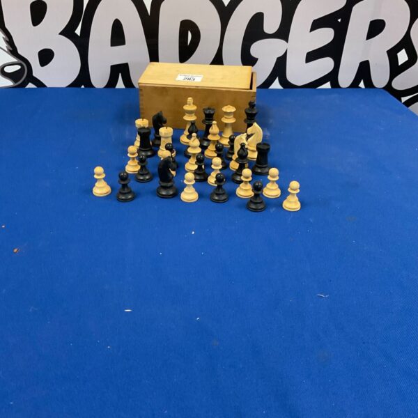 Vintage wooden chess set with Staunton style chessmen on display.