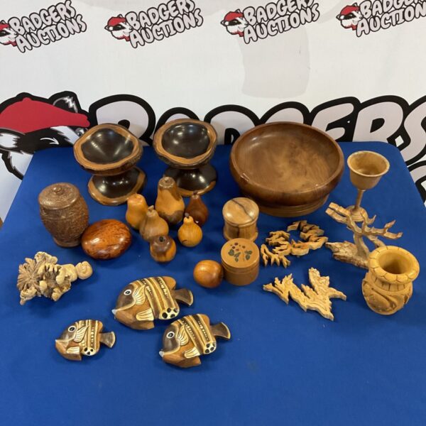 Collection of vintage wooden collectibles including bowls and fruit.