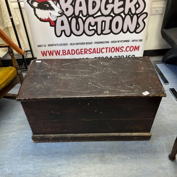 Vintage wooden crate with a hinged lid, ideal for storage.