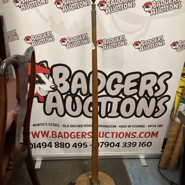 Vintage wooden floor lamp with a slender column.