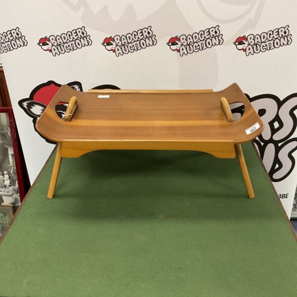 Vintage wooden serving tray with a retro design.