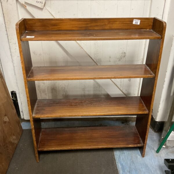 Vintage wooden sideboard with four shelves for storage and display.