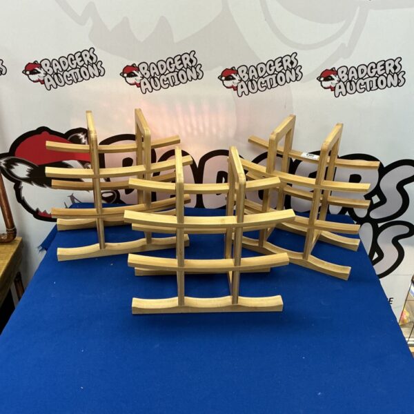 Set of three wooden wine racks for wine storage.