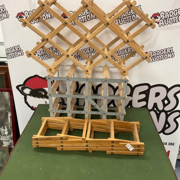 Set of three wooden wine racks for wine storage.