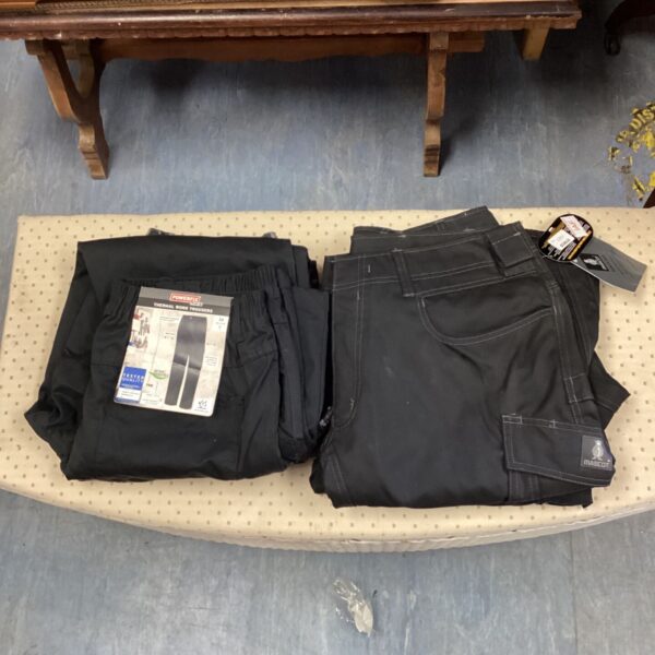 Lot of four durable work trousers in various sizes.