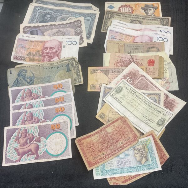 Collection of vintage world bank notes and foreign currency bills.