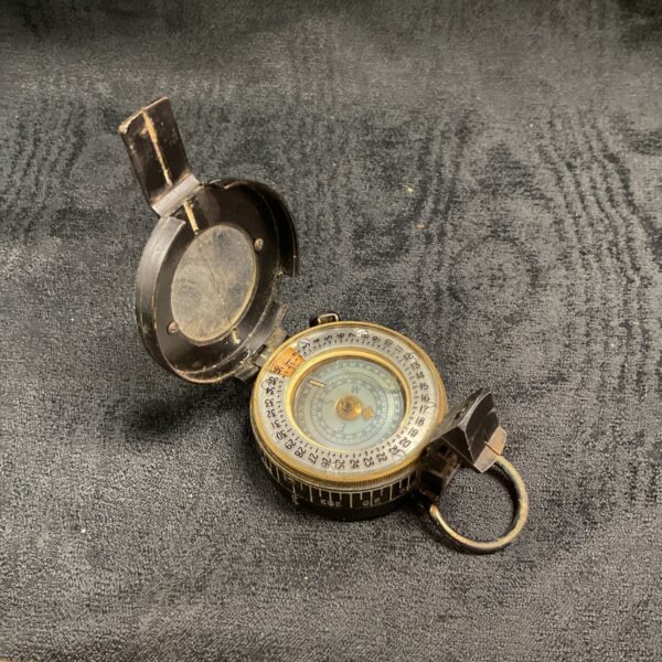 Vintage WW2 marching compass by T G Co Ltd, front view.