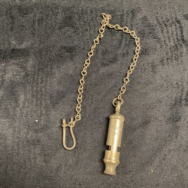 Vintage WW2 Hudson whistle with chain, British military collectible.