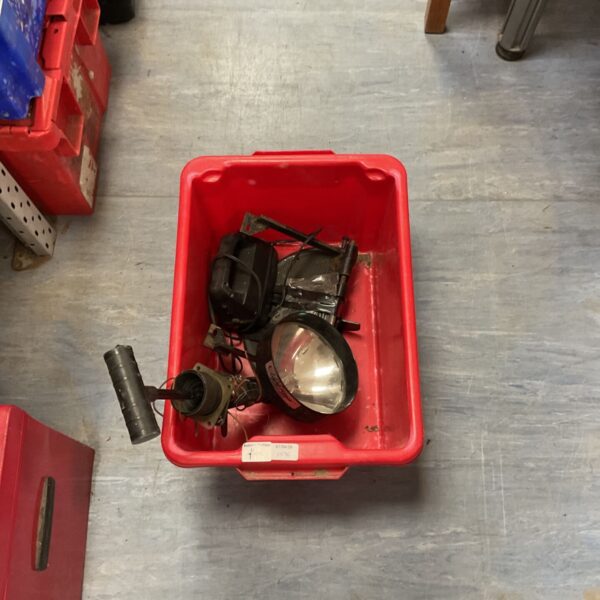 Vintage WWII Aldis signalling lamp in a red crate.