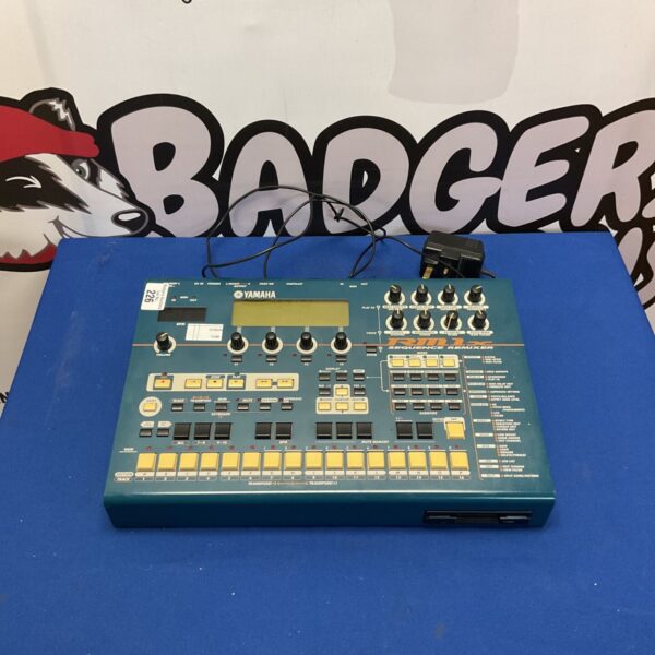 Vintage Yamaha RMX1x groovebox with knobs and buttons.