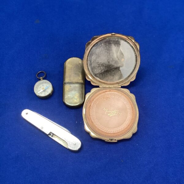 Vintage Yardley compact with penknife, compass, and mirror.